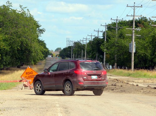 Colin Corneau/Brandon Sun
Grand Valley Road, near the federal agricultural research station, remained closed to traffic Monday after floodwaters receded enough for the road to resurface.