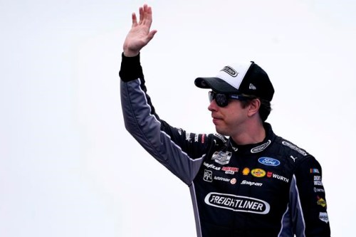 Brad Keselowski waves to fans before the NASCAR Cup Series auto race Sunday, July 18, 2021, in Loudon, N.H. (AP Photo/Charles Krupa)