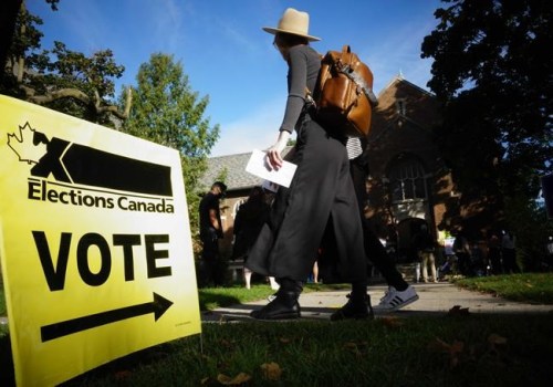 People start to line up early for the Canadian general election before polls open in west-end Toronto for the Monday, Sept. 20, 2021 election. The NDP has requested an official inquiry into what it calls “numerous and systemic failures of election officials” on election day. THE CANADIAN PRESS/Graeme Roy