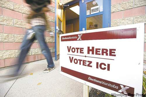 John Woods / The Canadian Press
A voter walks out of the polling station after voting in the Manitoba election in Winnipeg, Tuesday.