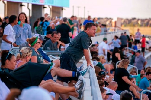 Mike Svoboda, from Prosper, Texas, watches the field during the opening of the new Children's Health Stadium at Prosper ISD on Saturday, Aug. 17, 2019, in Prosper. Democrats are out to show they’re serious about flipping Texas in 2020 by holding Thursday’s presidential debate in Houston. Republicans are coming off their worst election in Texas in a generation. Fast-changing suburbs are trending more liberal, and Democrats are counting on more left-leaning voters moving in to turn the state blue. But that transformation may not arrive by 2020, and the GOP is closely watching conservative bastions like the booming Dallas suburbs. (AP Photo/Nathan Hunsinger)