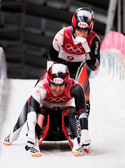 Tristan Walker, front, and Justin Snith of Canada react after competing in heat four of men's luge doubles during the 2018 Olympic Winter Games in Pyeongchang, South Korea on Wednesday, February 14, 2018. Walker and Snith finished fifth. THE CANADIAN PRESS/Nathan Denette