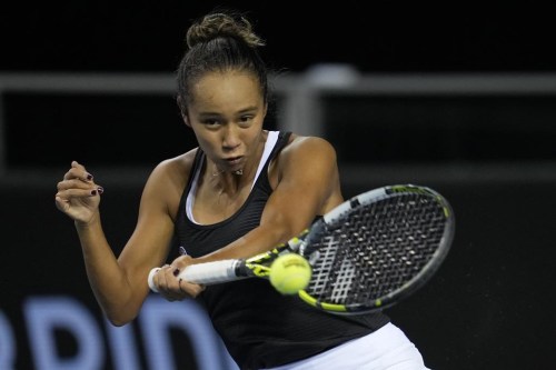 Canada's Leylah Fernandez plays a return to Switzerland's Belinda Bencic on the 4th day of the Billie Jean King Cup tennis finals at the Emirates Arena in Glasgow, Scotland Friday, Nov. 11, 2022. THE CANADIAN PRESS/AP/Kin Cheung