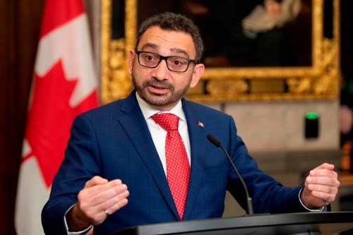 Minister of Transport Omar Alghabra speaks with members of the media after tabling legislation in the House of Commons, Thursday, Nov. 17, 2022 in Ottawa. THE CANADIAN PRESS/Adrian Wyld