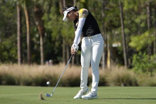 Atthaya Thitikul, of Thailand, hits her second shot from the first fairway during the first round of the LPGA CME Group Tour Championship golf tournament, Thursday, Nov. 17, 2022, at the Tiburón Golf Club in Naples, Fla. (AP Photo/Lynne Sladky)