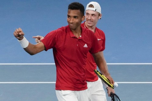 Canada's Denis Shapovalov and teammate Felix Auger-Aliassime, left, celebrate after defeating Britain's Jamie Murray and Joe Salisbury in their match at the ATP Cup tennis tournament in Sydney, Australia, Tuesday, Jan. 4, 2022. THE CANADIAN PRESS/AP-Mark Baker