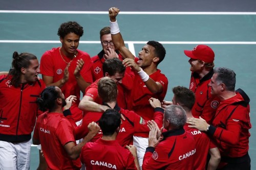 Canada's Felix Auger Aliassime, center, celebrates with teammate after defeating Australia's Alex de Minaur during the final Davis Cup tennis match between Australia and Canada in Malaga, Spain, Sunday, Nov. 27, 2022. THE CANADIAN PRESS/AP-Joan Monfort