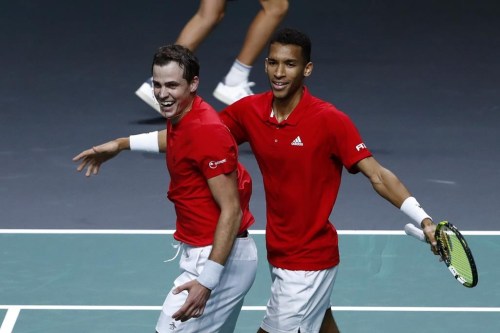 Canada's Vasek Pospisil, left, and Felix Auger Aliassime celebrate after defeating Italy's Matteo Berrettini and Fabio Fognini during the semi-final Davis Cup tennis doubles match between Italy and Canada in Malaga, Spain, Saturday, Nov. 26, 2022. Canada's Davis Cup team developed a foolproof ritual before each of its matches along the way to the country's first-ever championship. THE CANADIAN PRESS/AP-Joan Monfort