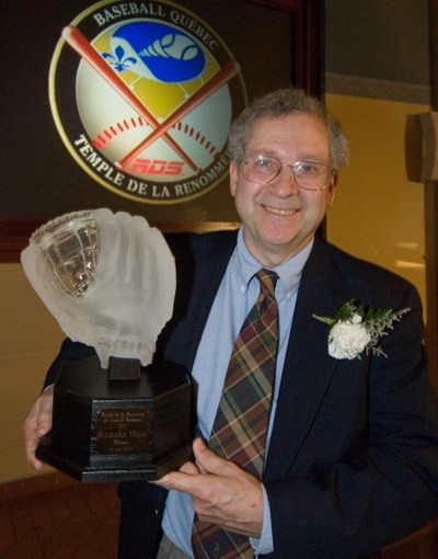 Richard Milo holds his trophy for being inducted into the Quebec Baseball Hall of Fame in Montreal Thursday May 31, 2007. Milo, a longtime Canadian Press writer, has been named the winner of the Canadian Baseball Hall of Fame and Museum’s 2022 Jack Graney Award. THE CANADIAN PRESS/Peter McCabe