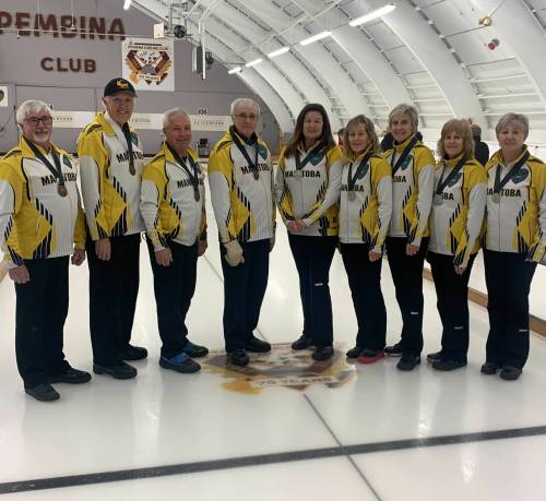 Fifth Gary Barker (left), who filled in for lead Red Warren, second Terry Warren, third Brian Barker and skip Murray Warren pose with Judy Colwell’s rink after the Manitoba squads both reached the podium at the 2022 Canadian Masters Curling Championship on Sunday. Warren took home a bronze medal while Colwell’s quartet captured a silver medal. (Photo courtesy Resby Coutts/thecurler.ca)