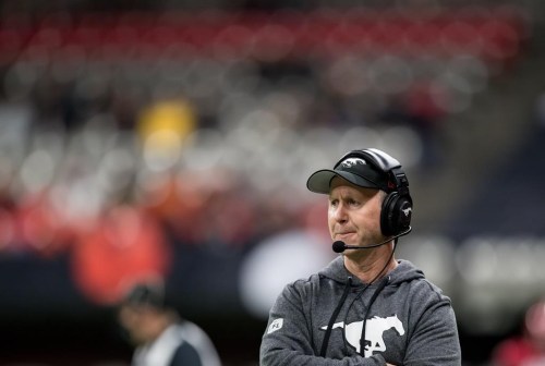 Calgary Stampeders head coach Dave Dickenson stands on the sideline during the first half of a CFL football game against the B.C. Lions in Vancouver, on Friday, November 12, 2021. Dickenson is taking over as general manager, while John Hufnagel will continue as team president. THE CANADIAN PRESS/Darryl Dyck