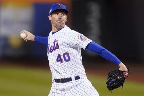 FILE - New York Mets starting pitcher Chris Bassitt delivers against the San Diego Padres during the first inning of Game 3 of a National League wild-card baseball playoff series on Oct. 9, 2022, in New York. The Toronto Blue Jays strengthened their rotation on Monday, Dec. 12, agreeing to a $63 million, three-year deal with Bassitt. (AP Photo/John Minchillo, File)