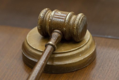 A gavel sits on a desk before the a meeting of the House Justice and Human Rights Committee in Ottawa, on February 13, 2019. Seven Manitoba churches are in court appealing a ruling that upheld COVID-19 restrictions on religious services. THE CANADIAN PRESS/Adrian Wyld