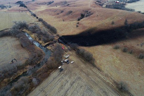 In this photo taken by a drone, cleanup continues in the area where the ruptured Keystone pipeline dumped oil into a creek in Washington County, Kan., Friday, Dec. 9, 2022. TC Energy Corp. says it has restarted the section of the Keystone pipeline that was unaffected by last week's oil leak.THE CANADIAN PRESS/AP, DroneBase