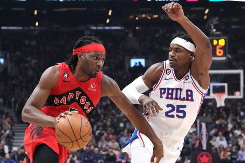 Toronto Raptors' Precious Achiuwa, left, drives at Philadelphia 76ers' Danuel House Jr. during first half NBA basketball action in Toronto on Friday, October 28, 2022. While Achiuwa has resumed some light practising, Toronto Raptors coach Nick Nurse erased any expecations the athletic forward would be back playing any time soon. THE CANADIAN PRESS/Chris Young