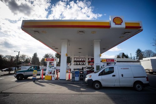 Motorists fuel up vehicles at a Shell gas station in Vancouver, on Tuesday, March 8, 2022. Shell Canada says its purchase of 56 gas stations from the parent company of Sobeys is part of Shell's long-term plan to grow its network of retail fuel stations across the country.THE CANADIAN PRESS/Darryl Dyck