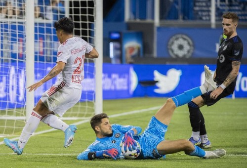 CF Montréal goalkeeper James Pantemis makes a save against New York Red Bulls' Omir Fernandez during second half MLS soccer action in Montreal, Wednesday, August 31, 2022. Montreal has signed Pantemis to a new contract for the 2023 season, with option years in 2024 and 2025. THE CANADIAN PRESS/Graham Hughes