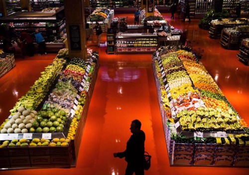 People shop in the produce area at a Loblaws store in Toronto on May 3, 2018. Shoplifting has surged to an alarming level across Canada, industry insiders say, with inflation and labour shortages cited as major factors behind the increase.THE CANADIAN PRESS/Nathan Denette