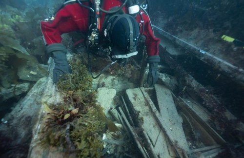 Parks Canada underwater archaeologist Jonathan Moore observes a washing basin and an officer's bedplace on the lower deck of the wreck of HMS Erebus during a dive in this September 2022 handout photo in the Northwest Passage. THE CANADIAN PRESS/HO, Parks Canada, Marc-Andre Bernier *MANDATORY CREDIT*