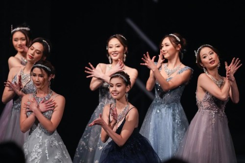 Competitors, including eventual winner Yi Yi Wang, front centre, dance during the Miss Chinese Vancouver Pageant, in Richmond, B.C., on Wednesday, November 30, 2022. The popularity of the 27-year-old pageant is testament to both the ongoing lure of celebrity in Hong Kong and Chinese show business, and what one expert calls the 