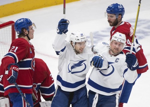 Tampa Bay Lightning's Brandon Hagel (38) celebrates a goal with teammate Steven Stamkos (91) against the Montreal Canadiens during second period NHL hockey action in Montreal, Saturday, Dec.17, 2022. THE CANADIAN PRESS/Graham Hughes