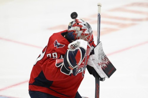 The puck flies over Washington Capitals goaltender Charlie Lindgren's head during the second period of an NHL hockey game against the Dallas Stars, Thursday, Dec. 15, 2022, in Washington. (AP Photo/Nick Wass)