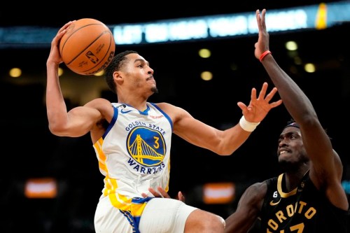 Toronto Raptors forward Pascal Siakam (43) tries to stop Golden State Warriors guard Jordan Poole (3) from going to the net during second half NBA basketball action in Toronto, Sunday, Dec. 18, 2022. Poole poured in a career-high 43 points as the Golden State Warriors earned a 126-110 win and handed the Toronto Raptors a fifth consecutive loss on Sunday. THE CANADIAN PRESS/Frank Gunn