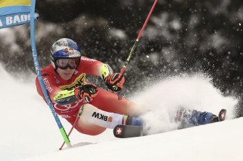 Switzerland's Marco Odermatt speeds down the course during an alpine ski, men's World Cup giant slalom, in Alta Badia, Italy, Monday, Dec. 19, 2022. (AP Photo/Gabriele Facciotti)