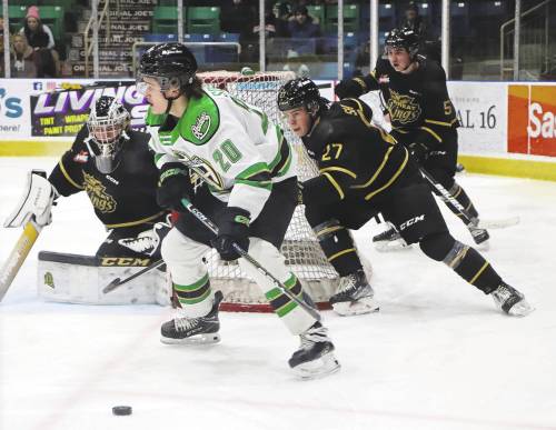 Prince Albert Raiders Keaton Sorensen skates with the puck behind Brandon Wheat Kings goaltender Carson Bjarnason's net while defenceman Luke Shipley (27) gives chase during their Western Hockey League game in Prince Albert last week. Shipley has four points in eight games since arriving in Brandon. (Nathan Reiter/Prince Albert Daily Herald)