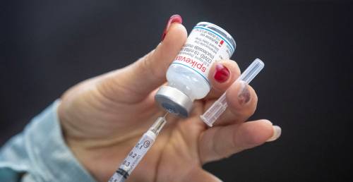 A person draws out Moderna vaccine during a drive through COVID-19 vaccine clinic in Kingston, Ont., last year. Research into Omicron infections in older adults has highlighted the importance of COVID-19 vaccine booster shots. (File)
                                A person draws out Moderna vaccine during a drive through COVID-19 vaccine clinic in Kingston, Ont., last year. Research into Omicron infections in older adults has highlighted the importance of COVID-19 vaccine booster shots. (File)