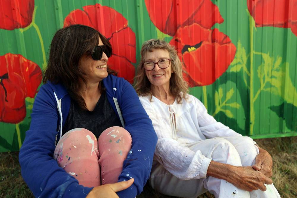 Erica Lowe (left) and her mother Mary Lowe have been painting murals for nearly two decades in the Westman area. They say they work as a good team because they can be honest with each other. (Connor McDowell/The Brandon Sun)