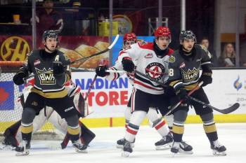 Rylen Roersma (18) and Matteo Michels (88) of the Brandon Wheat Kings and Aiden Ziprick (21) of the Moose Jaw Warriors watch the puck in front of Warriors netminder Jackson Unger during last season’s Western Hockey League playoffs at Westoba Place. The Wheat Kings host the Warriors on Friday to open the 2024-25 WHL regular season. (File)