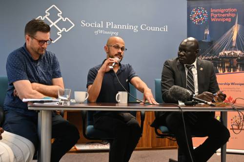 Researchers Matt Fast (from left), Darrien Morton and David Mabior Atem share their findings on newcomers’ safety concerns during a Saturday event in downtown Winnipeg. (Matthew Frank/Winnipeg Free Press)