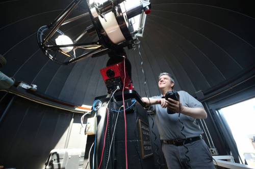 Prof. Tyler Foster with Brandon University’s Department of Physics and Astronomy operates the BU Observatory telescope, found at the top of the John R. Brodie Science Centre on Wednesday morning. (Matt Goerzen/The Brandon Sun)