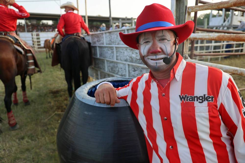 Scott Byrne poses beside his rodeo barrel, which acts as a punching bag for raging bulls. The 53-year-old is serving as the rodeo clown at the 69th annual Manitoba Threshermen’s Reunion and Stampede. Byrne pivoted into clowning as a way to stay involved after retiring from a 23-year career as a bullfighter. (Connor McDowell/The Brandon Sun)