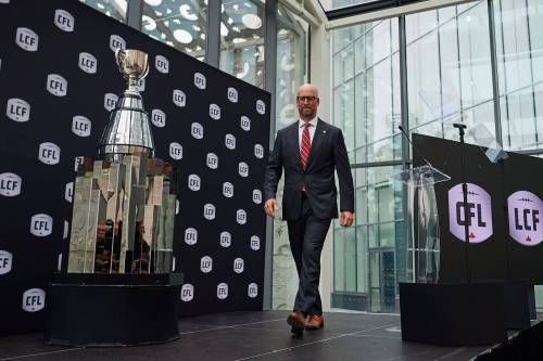 CFL Commissioner Stewart Johnston leaves the stage after speaking at a press conference in Toronto on Sept. 22. Johnston has made some adjustments to the Canadian game that bring it more in line with the NFL, leading to accusations that the CFL is being Americanized. (The Canadian Press)