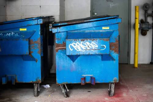 The dumpsters behind a Manitoba Housing building at 24 Carlton St. in Winnipeg, where a 27-year-old woman was assaulted and forcibly confined before being abandoned in a dumpster, while still restrained, in 2023. (Mikaela MacKenzie/Winnipeg Free Press files)