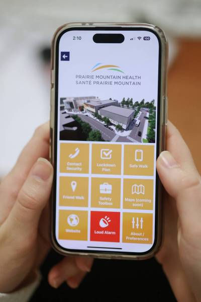 A smartphone displays selections for Prairie Mountain Health on screen for the Shared Health mobile app, SAFE. It provides staff with real-time alerts, a direct connection to security services, emergency notifications and personal safety tools. (Matt Goerzen/The Brandon Sun)