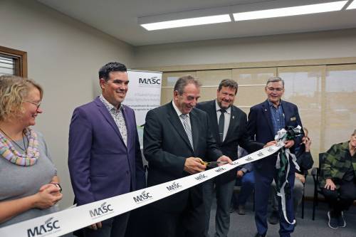 In this file photo, Agriculture Minister Ron Kostyshyn cuts the ribbon at Virden&rsquo;s new MASC office at a grand-opening in September 2025. Mayor Tina Williams (from left), RM of Wallace-Woodworth Reeve Clayton Canart, Municipal and Northern Relations Minister Glen Simard, and MASC chair John Plohman. (Connor McDowell/The Brandon Sun file)