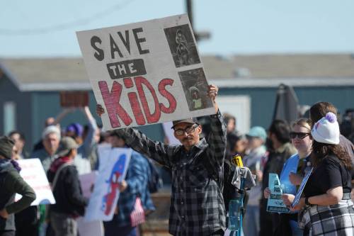 Protesters gather outside the South Texas Family Residential Center detention facility where Liam Ramos and his father were being detained in Dilley, Texas, in January 2026. Conditions at the immigration jail, in particular for children, continue to be a concern. (The Associated Press)
