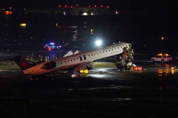 Pilot and copilot killed in collision between jet and fire truck at New York’s LaGuardia Airport