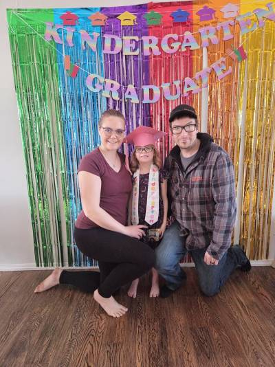 Emily and Nelson Gould are seen with their six-year-old daughter. She graduated Kindergarten in March after struggling to learn the curriculum in public school and subsequently switching to homeschooling. Her parents met with a local homeschool supporter and advocate, Larissa MacDonald, for a consultation about whether homeschooling could work, and after the meeting they decided to move forward with it. Emily said her daughter is thriving now. (Emily Gould/Facebook)