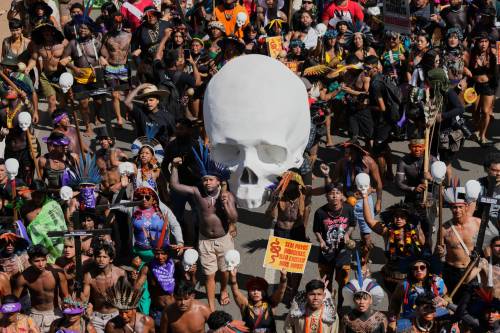 Indigenous protesters march during the annual &ldquo;Acampamento Terra Livre,&rdquo; or Free Land Encampment, Brazil&rsquo;s largest annual Indigenous mobilization that focuses on land rights and environmental protection, in the capital, Brasilia, on Tuesday. (The Associated Press)
