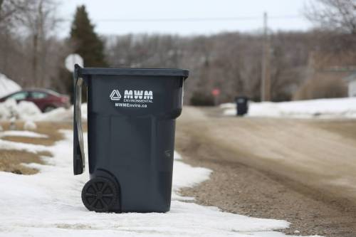 A garbage container on the side of the road in Minnedosa in April. The town introduced garbage containers in 2025 for bags to be placed into, having previously collected garbage bags off the side of the road. The town CAO said she is hopeful the new collection method will decrease the number of crows and magpies in town.