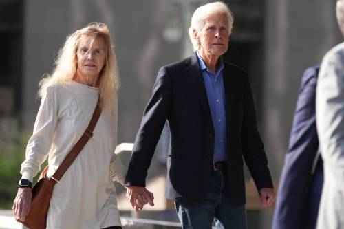 Suzanne Morrison, the mother of Matthew Perry, walks into court with her husband Keith Morrison before Jasveen Sangha, who pleaded guilty to selling Perry a lethal dose of the drug ketamine in the days before his death, appears in court for sentencing in Los Angeles on Wednesday. (The Associated Press)