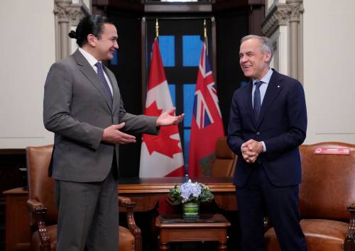 Prime Minister Mark Carney (right) meets with Manitoba Premier Wab Kinew on Parliament Hill in Ottawa on Tuesday. The Port of Churchill expansion, roads and CentrePort Churchill were among the topics discussed. (The Canadian Press)