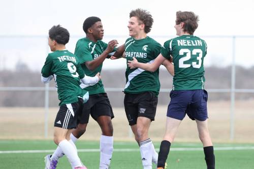 Emytt Pearce of the Neelin Spartans (third from left) is mobbed by teammates as he celebrates a goal during varsity boys soccer against the Crocus Plainsmen at Cougars Field in Brandon on Monday afternoon. (Tim Smith/The Brandon Sun)