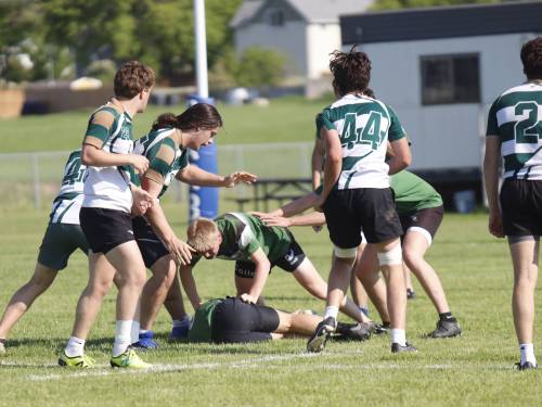 A crowd of players from the St. John&rsquo;s-Ravenscourt Eagles and Dauphin Clippers swarm a Clippers forward following a ruck during the first half of semifinals action. Dauphin dismantled St. John&rsquo;s-Ravenscourt and will face St. Paul&rsquo;s in the championship game today. (Massimo De Luca-Taronno/The Brandon Sun)
