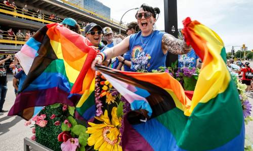 People take part in the Pride Parade in downtown Winnipeg on Sunday. The annual event has brought the LGBTTQ+ community and its allies together to celebrate since 1987. (John Woods/Winnipeg Free Press)