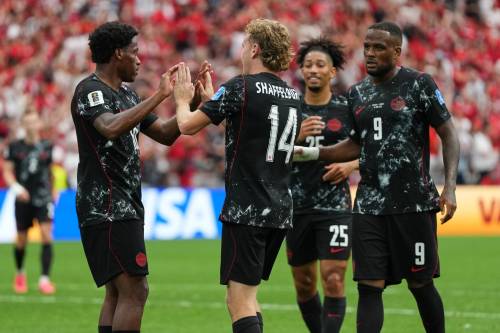 Abbie Parr / THE ASSOCIATED PRESS
                                Jonathan David&rsquo;s (left) teammates celebrate his hat trick in Vancouver on Thursday. Canada&rsquo;s 6-0 route of Qatar made history as no CONCACAF team has scored more than four goals in a single game at the World Cup.